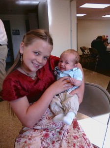 My daughter beth with her new baby cousin - taken with Palm Pre and flash. Click on the image for full resolution shot.